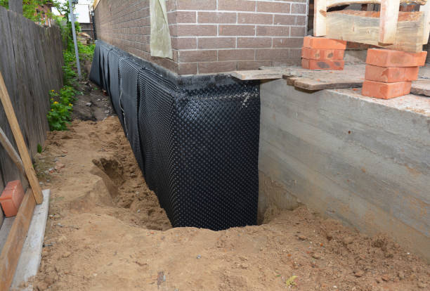SJ Waterproofing Pros technician performing targeted Interior Drainage System assessment in Ecorse, MI